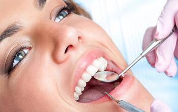 Woman receiving dental exam