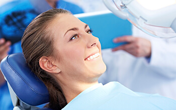 doctor checking patient's teeth