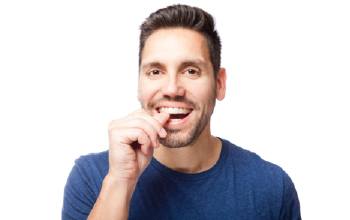 Man placing Invisalign tray