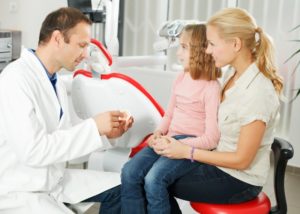 family visiting their dentist